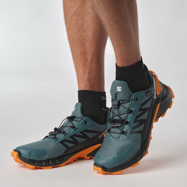 Trailové běžecké boty Salomon Supercross 4 GTX Gore-tex M L47119800 Stargazer Black Turmeric 25/26